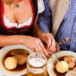 couple-eating-roast-pork-bavarian-restaurant-comp